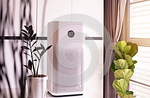 White modern air purifier in a living room for refresh air flow at home,Advanced air purifying and protect Pm2.5