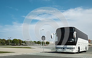 White Modern comfortable tourist bus driving through highway. Travel and coach tourism concept. Trip journey by vehicle