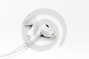 White modern headphones with a headset on a light gray background