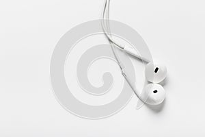 White modern headphones with a headset on a light gray background