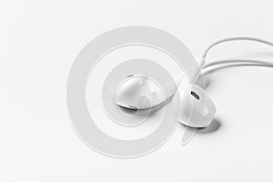 White modern headphones with a headset on a light gray background