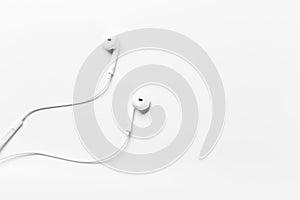 White modern headphones with a headset on a light gray background