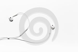 White modern headphones with a headset on a light gray background