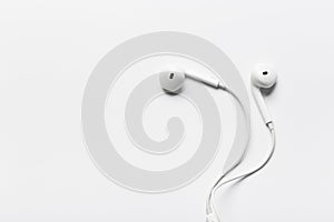 White modern headphones with a headset on a light gray background