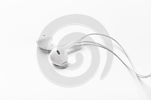 White modern headphones with a headset on a light gray background