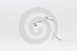 White modern headphones with a headset on a light gray background