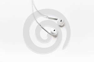 White modern headphones with a headset on a light gray background