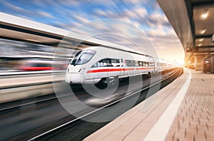 White modern high speed train in motion