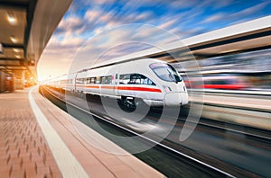 White modern high speed train in motion