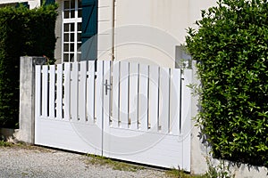 White modern home door aluminum gate slats portal of suburb house