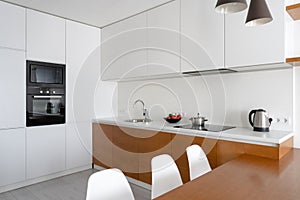 White modern kitchen room with modern interior in cozy flat