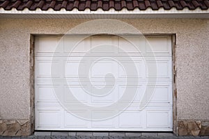 White modern sectional garage doors on building