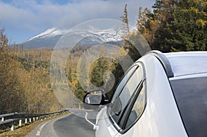 White, modern SUV on the mountain road