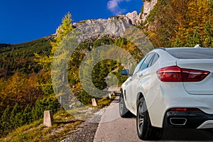 White, modern SUV on the mountain road