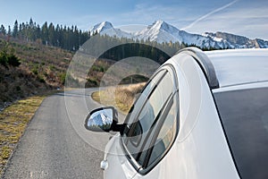 White, modern SUV on the mountain road