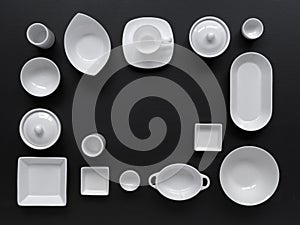 White, modern tableware in various designs on a black background