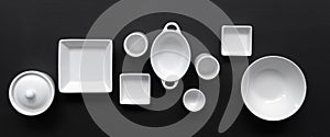White, modern tableware in various designs on a black background