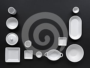 White, modern tableware in various designs on a black background