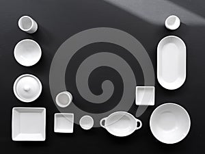 White, modern tableware in various designs on a black background