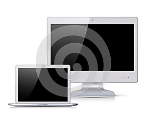 White monitor and notebook with black screen