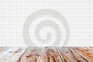 White mosaic glassy wall and brown wooden floor