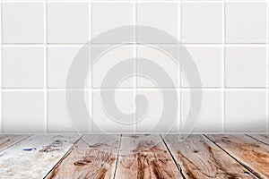 White mosaic wall and brown wooden floor