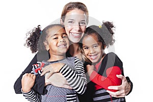 White mother with black child family posing on a white background studio