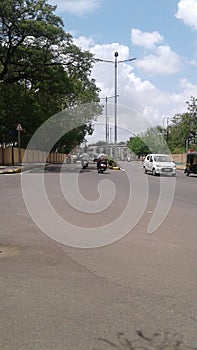 White motor car drives in the street of Maharashtra photo
