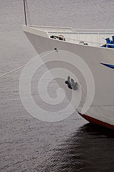 White motor ship stands on water surface