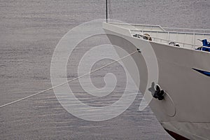 White motor ship stands on water surface