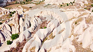 White Mountains in Cappadocia Turkey, Birds eye view 4k aerial drone. Red and Pink Rocks, Dramatic geological wonder