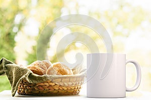 White Mug Mockup, next to a basket of bread.