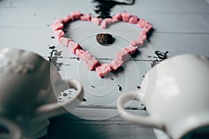 A white mug with pink heart