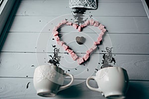 A white mug with pink heart