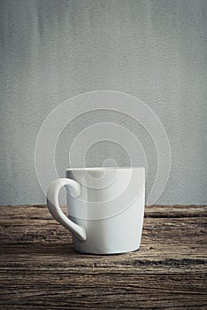 White mug on wooden tabletop