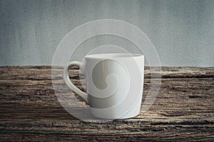 White mug on wooden tabletop