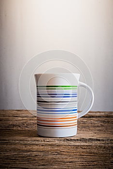 White mug on wooden tabletop