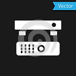 White Multimedia and TV box receiver and player with remote controller icon isolated on black background. Vector