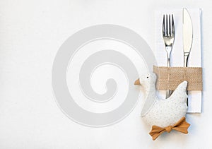 White napkin, knife and fork, place for dinner served in rustic