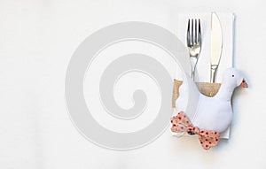 White napkin, knife and fork, place for dinner served in rustic