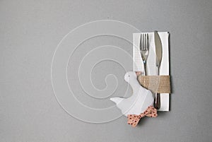 White napkin, knife and fork, place for dinner served in rustic