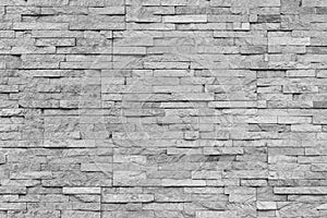 White natural facade stone decoration quartzite background texture. modern granite stone wall