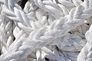 White nautical mooring rope on boat deck