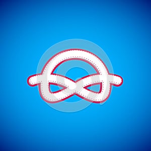 White Nautical rope knots icon isolated on blue background. Rope tied in a knot. Vector