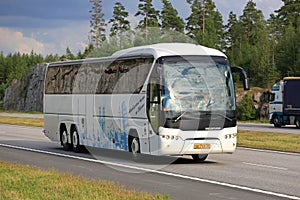 White Neoplan Tourliner Coach Bus in Motorway Traffic