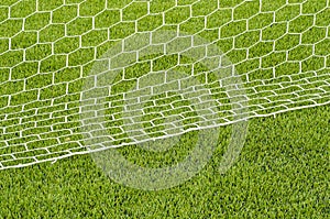 The white Net marking on the artificial green grass soccer field