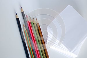 White note paper with pencils
