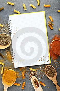 White notebook with different spices