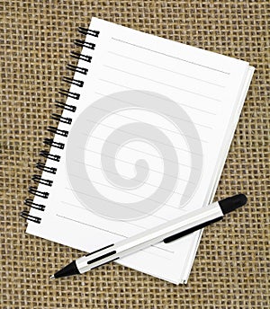 White notebook isolated with pen