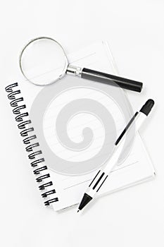 White notebook isolated with pen photo